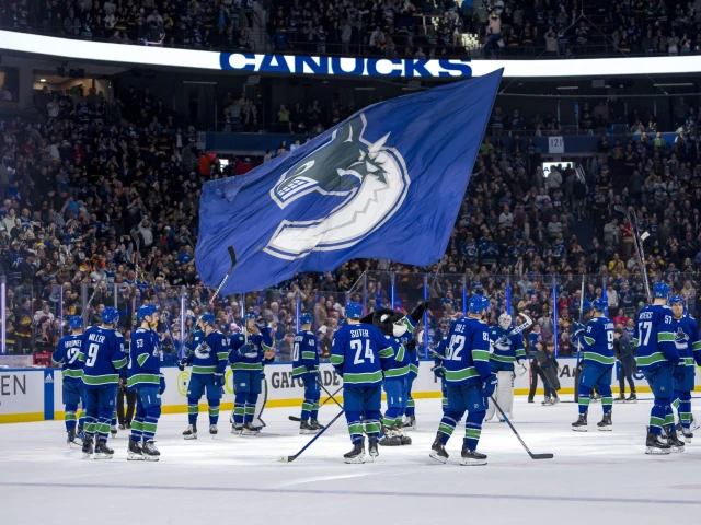 Vancouver Canucks clinch Pacific Division with victory over the Calgary Flames