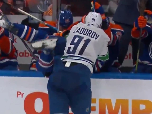 Canucks’ Zadorov absolutely levels Kane into Oilers bench