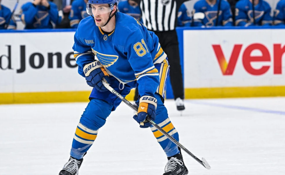 Blues' Holloway in stable condition after being hit in throat by puck