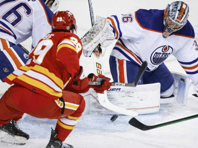 Malone scores overtime winner as Oilers rally to beat Flames