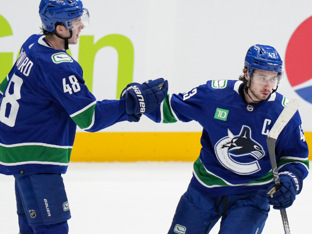 Two goals from Hughes leads Canucks over Oilers for first pre-season win