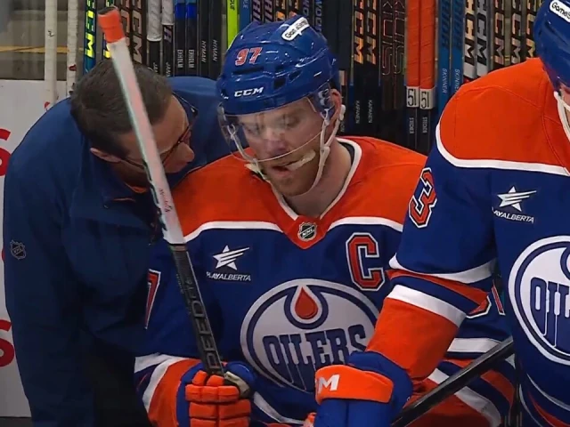 Jets’ Morrissey gets piece of Oilers’ McDavid, who leaves game with injury