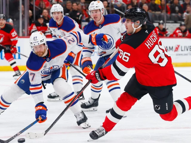 Hughes scores two goals as Devils beat Oilers