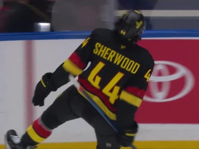 Canucks’ Sherwood dances around Ekholm with toe drag and pots beauty goal