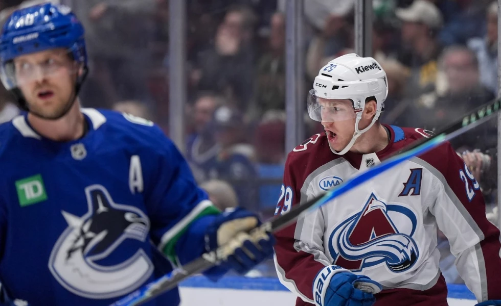 MacKinnon nets five points as Avalanche beat Canucks in overtime