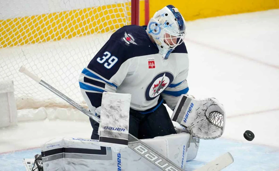 Blackhawks trade goalie Laurent Brossoit to Sharks in four-player deal