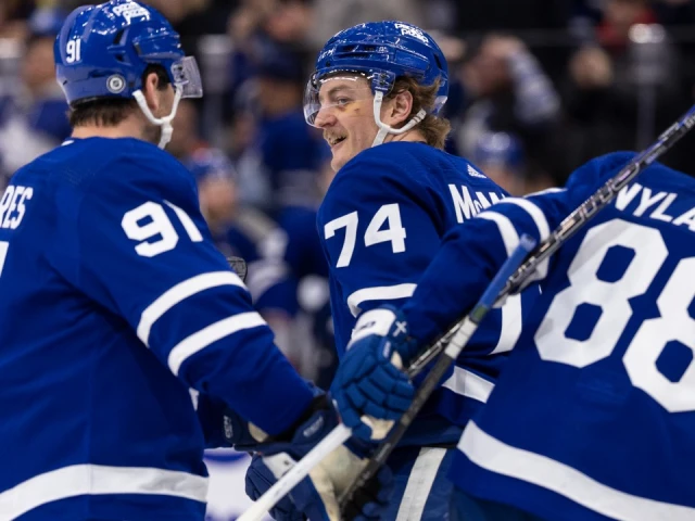 McMann, Holmberg each score twice as Maple Leafs hold off Oilers